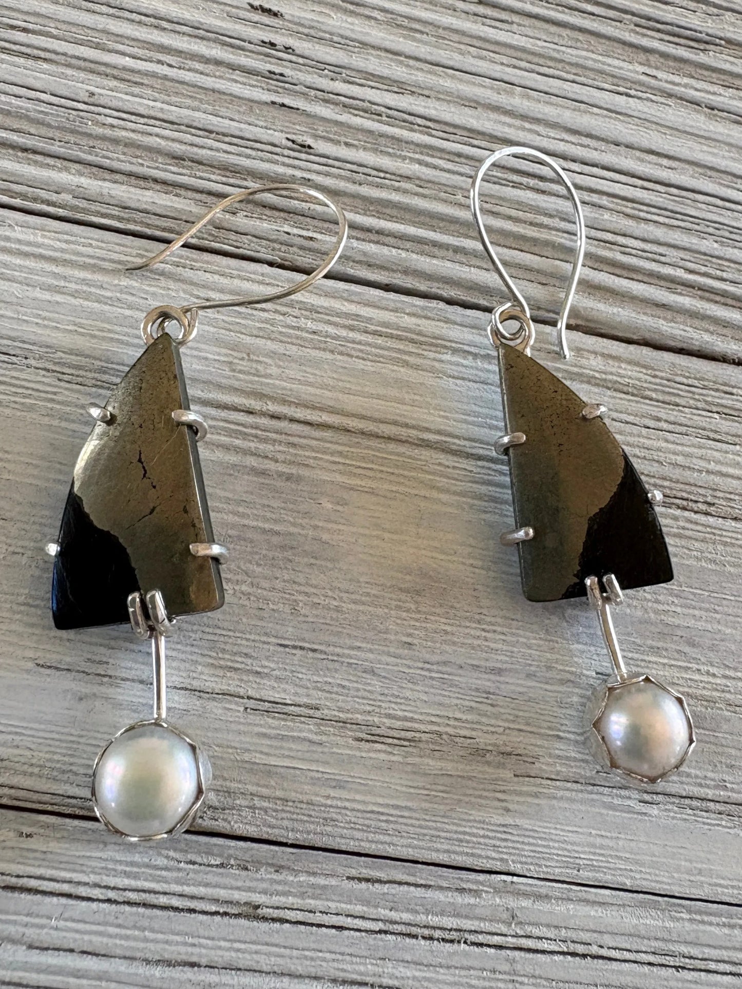 Paarisha Jewelry dangle earrings featuring triangular pyrite stones and dangling white pearls in sterling silver.