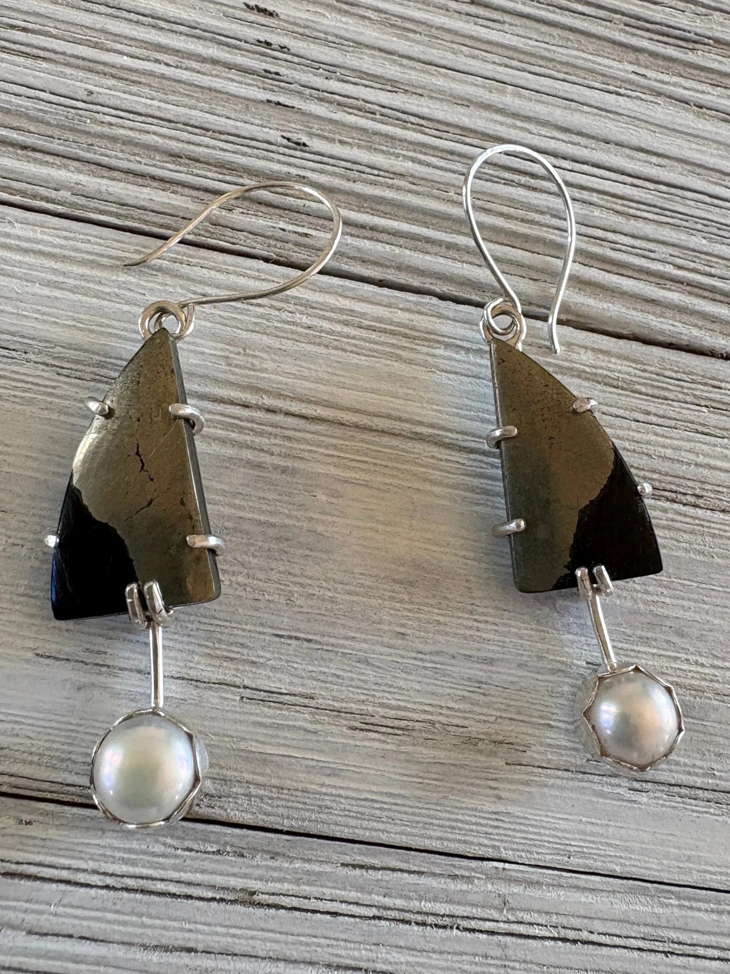 Paarisha Jewelry dangle earrings featuring triangular pyrite stones and dangling white pearls in sterling silver.