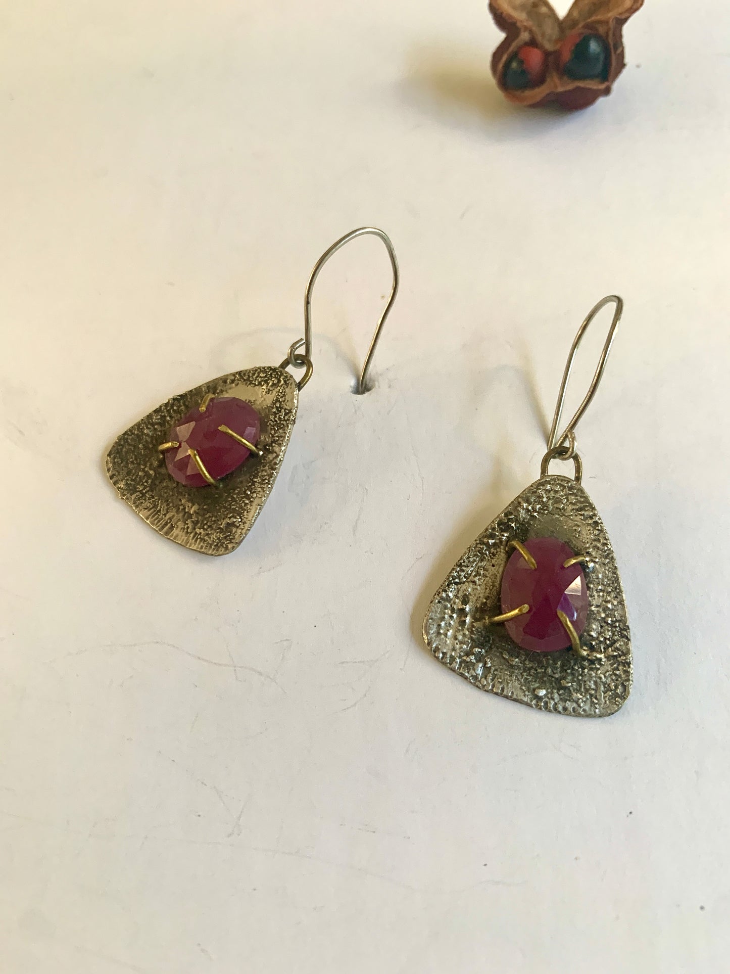Ruby and textured silver triangle dangle earrings